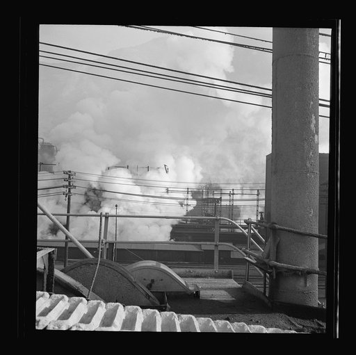 Untitled photo, possibly related to: Columbia Steel Company at Ironton, Utah. Looking upon coke ovens. The steam indicates that coke is being wetted.