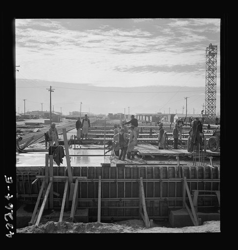 Columbia Steel Company at Geneva, Utah. Steel and concrete go into place rapidly as a new steel mill takes form. The new plant will make important additions to the vast amount of steel needed for the war effort