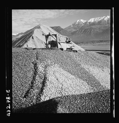 Untitled photo, possibly related to: Columbia Steel Company at Geneva, Utah. Bulldozer handling gravel for concrete during the construction of a new steel mill which will make important additions to the vast amount of steel needed for the war effort
