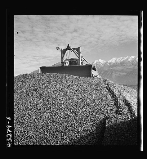 Columbia Steel Company at Geneva, Utah. Bulldozer handling gravel for concrete during the construction of a new steel mill which will make important additions to the vast amount of steel needed for the war effort