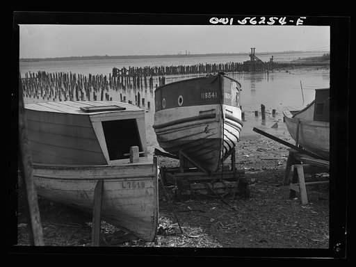 Chester, Pennsylvania. Boats on the Delware River shore