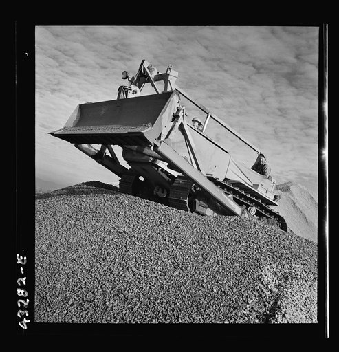 Columbia Steel Company at Geneva, Utah. Bulldozer handling gravel for concrete during the construction of a new steel mill which will make important additions to the vast amount of steel needed for the war effort