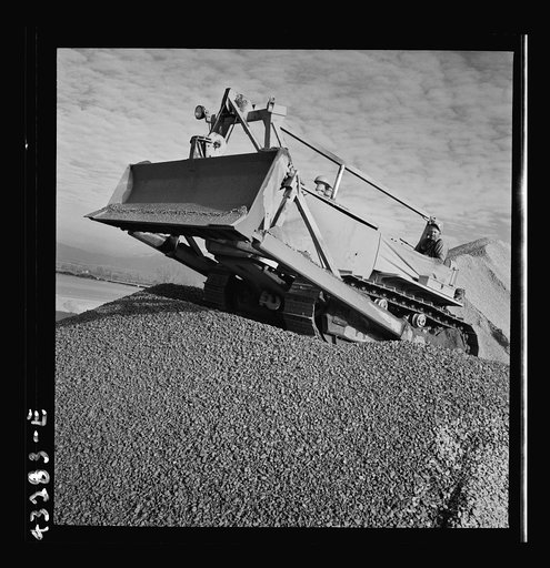Untitled photo, possibly related to: Columbia Steel Company at Geneva, Utah. Bulldozer handling gravel for concrete during the construction of a new steel mill which will make important additions to the vast amount of steel needed for the war effort