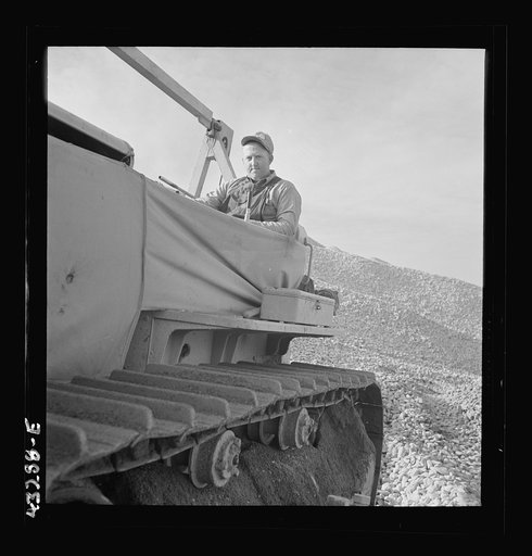 Columbia Steel Company at Geneva, Utah. Bulldozer handling gravel for concrete during the construction of a new steel mill which will make important additions to the vast amount of steel needed for the war effort