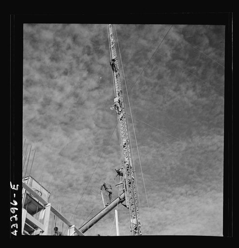 Untitled photo, possibly related to: Columbia Steel Company at Geneva, Utah. Surveyor running lines for a water intake tunnel to serve a new steel mill under construction which will make important additions to the vast amount of steel needed for the war effort