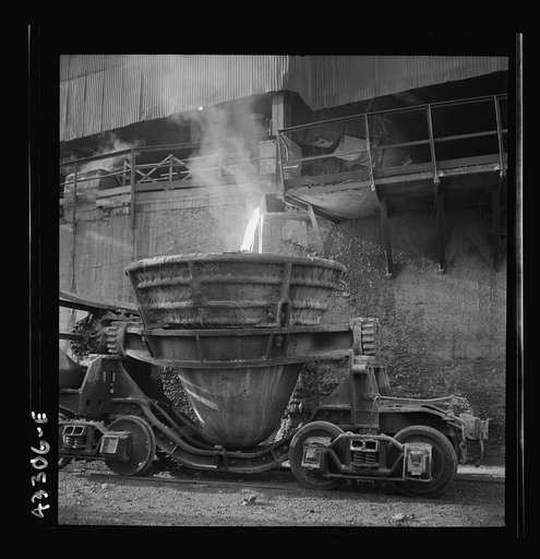 Untitled photo, possibly related to: Columbia Steel Company at Ironton, Utah. Tapping a blast furnace for an iron cast