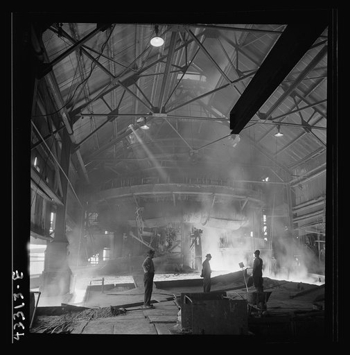 Untitled photo, possibly related to: Columbia Steel Company at Ironton, Utah. Tapping a heat of iron in the cast house of the blast furnace
