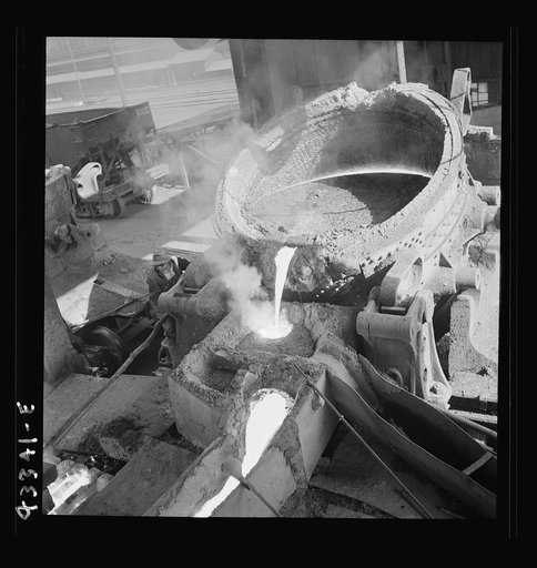 Columbia Steel Company at Ironton, Utah. Pouring a heat of iron