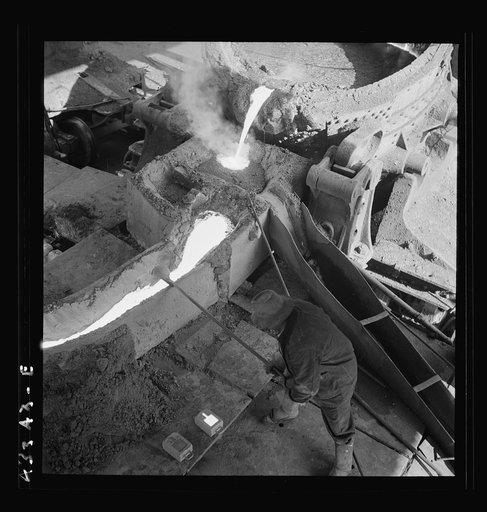 Columbia Steel Company at Ironton, Utah. Pouring a heat of iron