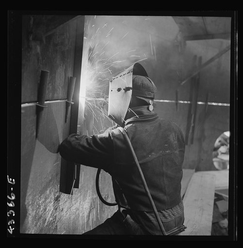 Columbia Steel Company at Geneva, Utah. An electric arc welder helping in the construction of a new steel mill which will make important additions to the vast amount of steel needed for the war effort