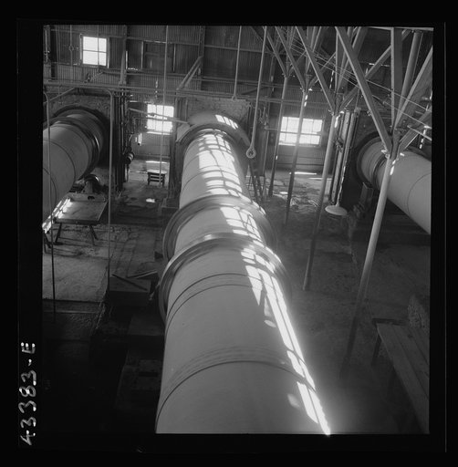 New Idria, California. A rotary kiln at the mercury extraction plant of the New Idria Quicksilver Mining Company. A 1200 degree Fahrenheit heat drives off the sulphur and vaporizes the mercury which is later condensed