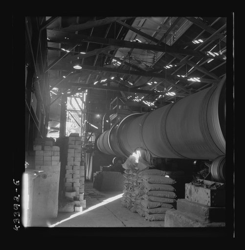 New Idria, California. A rotary kiln at the mercury extraction plant of the New Idria Quicksilver Mining Company. A 1200 degree Fahrenheit heat drives off the sulphur and vaporizes the mercury, later condensed