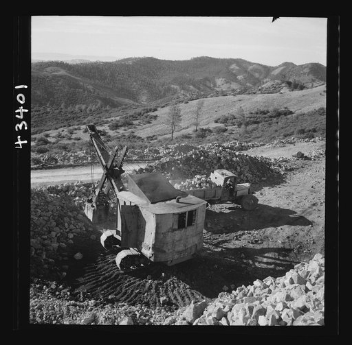New Idria, California. A power shovel loading mercury ore, called cinnabar, at an open-cut mine of the New Idria Quicksilver Mining Company