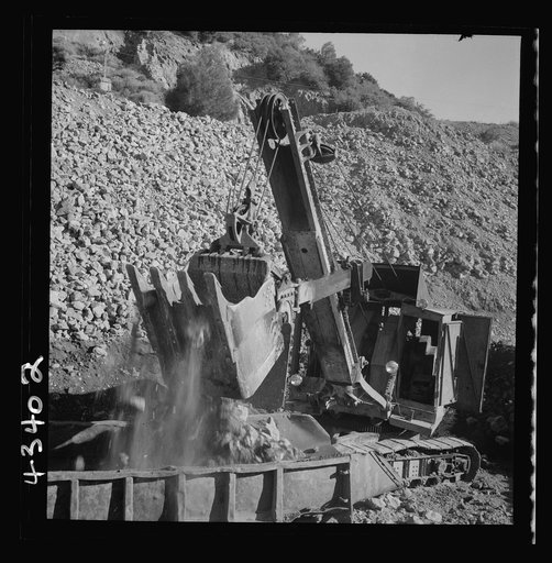New Idria, California. A power shovel loading mercury ore, known as cinnabar, at an open-cut mine of the New Idria Quicksilver Mining Company
