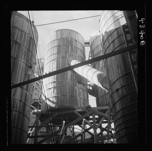 New Idria, California. Tanks at the mercury extraction plant of the Quicksilver Mining Company where mercury is obtained from cinnabar, an ore mined at a number of workings near the plant