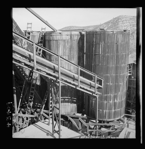 Untitled photo, possibly related to: New Idria, California. Tanks at the mercury extraction plant of the Quicksilver Mining Company where mercury is obtained from cinnabar, an ore mined at a number of workings near the plant