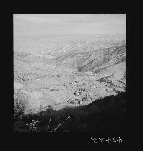 Untitled photo, possibly related to: New Idria, California. A birds-eye view of New Idria showing vicinity of the mine workings and, in the valley, the mercury extraction plant of the New Idria Quicksilver Mining Company