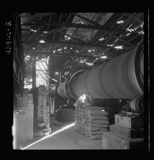 Untitled photo, possibly related to: New Idria, California. A rotary kiln at the mercury extraction plant of the New Idria Quicksilver Mining Company. A 1200 degree Fahrenheit heat drives off the sulphur and vaporizes the mercury which is later condensed