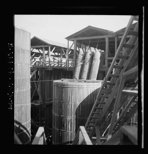 Untitled photo, possibly related to: New Idria, California. Tanks at the mercury extraction plant of the Quicksilver Mining Company where mercury is obtained from cinnabar, an ore mined at a number of workings near the plant