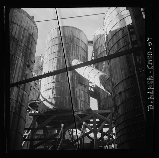 Untitled photo, possibly related to: New Idria, California. Tanks at the mercury extraction plant of the Quicksilver Mining Company where mercury is obtained from cinnabar, an ore mined at a number of workings near the plant