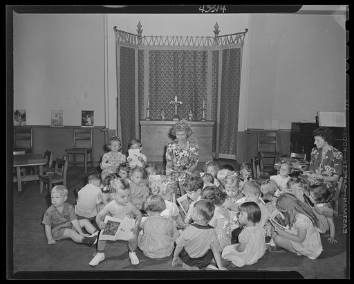 Brooklyn, New York. Children studying pictures at the Sunday school of the Church of the Good Shepherd