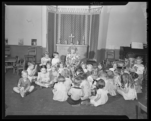 Brooklyn, New York. Children studying pictures at the Sunday school of the Church of the Good Shepherd