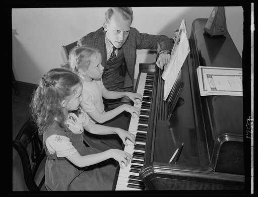 Brooklyn, New York. Mr. Haite giving a music lesson at the Church of the Good Shepherd