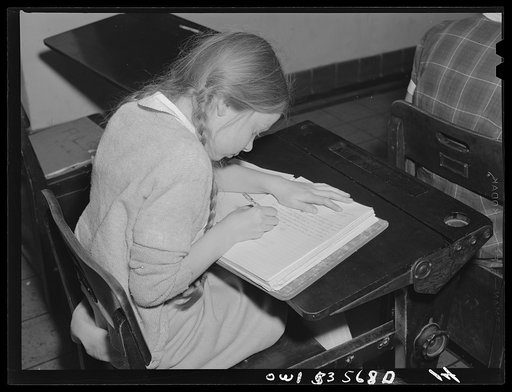 Wilmington, Delaware. Tower Hill School, noted country day school for pupils from three to eighteen years of age. A young pupil writing in a notebook at her desk