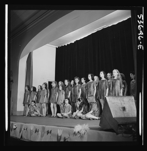 New York, New York. The girls of a singing and dancing class at Greenwich House who receive day care after school and on Saturdays while their mothers work, putting on a program for the entertainment of playmates and the nursery school group