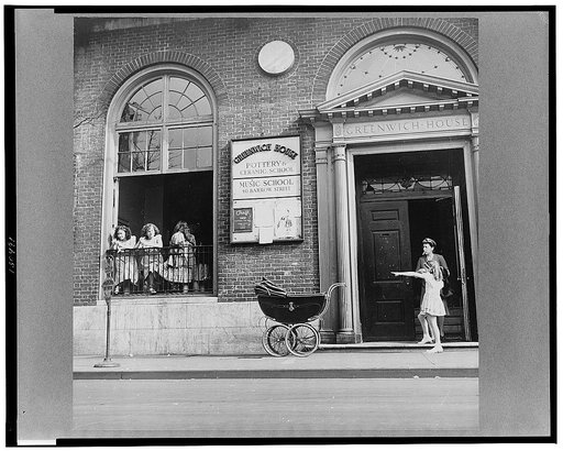 New York, New York. A mother and child at the Greenwich House entrance where the little girl receives day care while her mother works