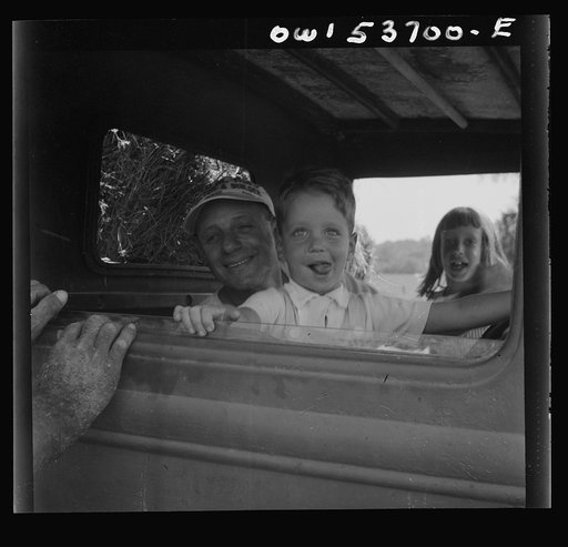 Untitled photo, possibly related to: Dresher, Pennsylvania. The owner of the Spring Run Farm driving a tractor