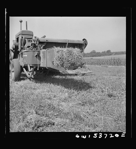 Dresher, Pennsylvania. Baling machine operating at the Spring Run Farm