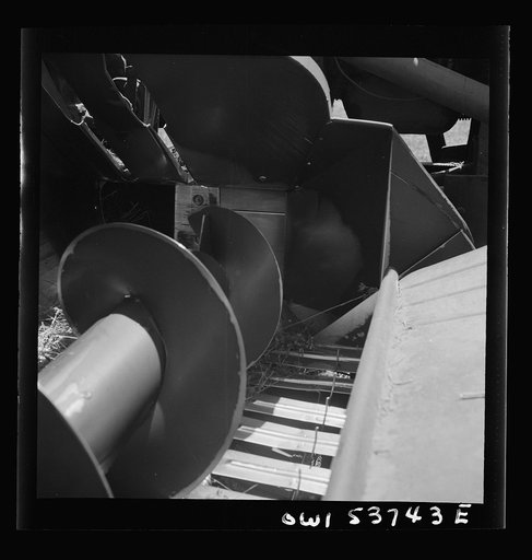 Dresher, Pennsylvania. Detail of a hay baler showing rotating knives which cut hay into proper lengths