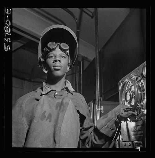 NYA (National Youth Administration) work center, Brooklyn, New York. A Negro, who is receiving training in arc welding, adjusting the output of a motor generator set