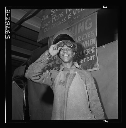NYA (National Youth Administration) Center, Brooklyn, New York. A Negro who is receiving training in machine shop practice shown in his welder's outfit