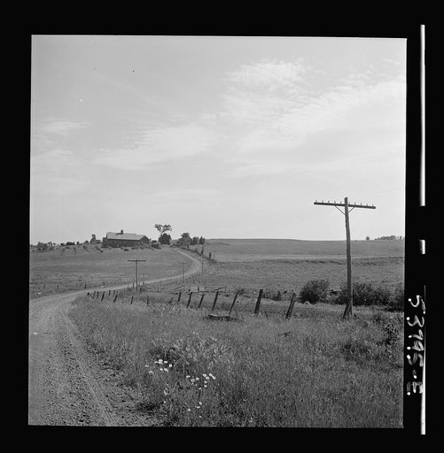 East Montpelier, Vermont. A country road leading to the Charles Ormsbee farm which appears in the distance