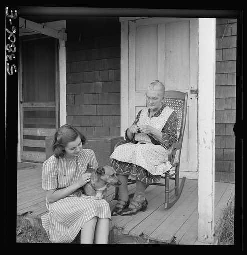 East Montpelier, Vermont. Mrs. [Myrtie] Ormsbee and Marilyn, mother and daughter of farmer Charles Ormsbee. Mrs. Ormsbee is knitting sweaters for the Red Cross