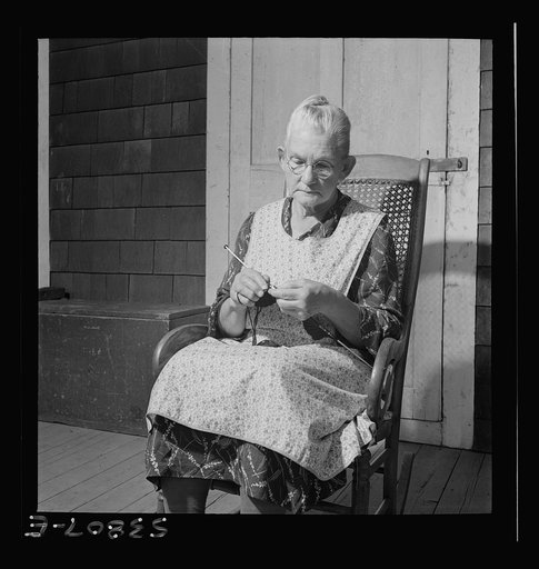East Montpelier, Vermont. Charles Ormsbee's widowed mother, [Myrtie] Ormsbee, knitting sweaters for the Red Cross. Mr. Ormsbee increased his produce, milk, and wood to aid the war effort, and all the members of his family aid in many ways