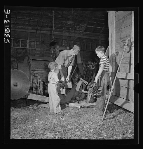 Untitled negative showing Charles Ormsbee and sons Richard and Conrad collecting scrap metal for the war effort, East Montpelier, Vermont