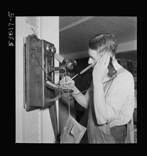 West Danville, Vermont. Mr. Hastings in his general store taking an order over the telephone