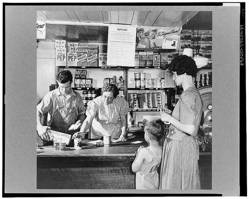 West Danville, Vermont. "What else will it be today, Mrs. Metcalf?" asks Mrs. Hastings, who has clerked in the general store owned by Mr. and Mrs. Hastings for twenty-nine years. Ronald Drown is looking on