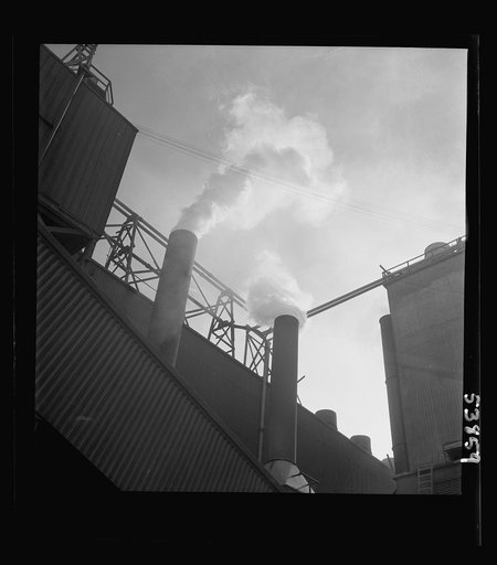 Las Vegas, Nevada. Smoke pouring from the stacks of the preparation building of the Basic Magnesium Incorporated plant, where magnesium, the lightest of all metals is being produced in great quantities for war use