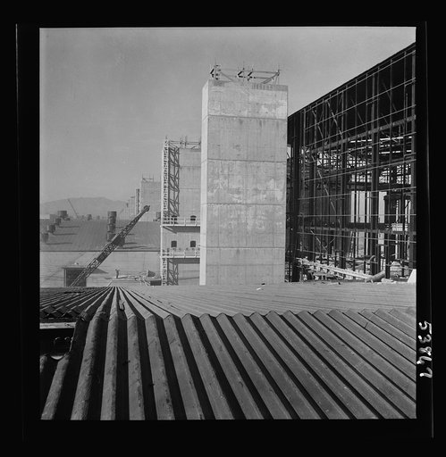 Las Vegas, Nevada. Some completed and also some unfinished buildings of the Basic Magnesium Incorporated plant. The building at the far right of the picture is still in the steel structure stage