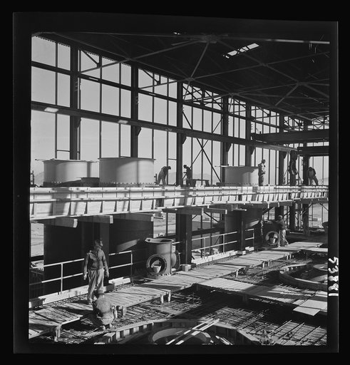 Las Vegas, Nevada. A construction scene at the Basic Magnesium Incorporated plant in the southern Nevada desert, showing workmen engaged in the steel structure of one of the chlorination plants