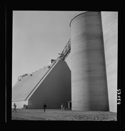 Las Vegas, Nevada. Giant silos, eighty-four feet high, for the storage of ore for the manufacture of magnesium, and a peat-storage building on the grounds of Basic Magnesium Incorporated
