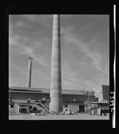 Las Vegas, Nevada. A view of the plant of Basic Magnesium Incorporated, showing a tool shed and part of two buildings on which construction is going forward rapidly for the production of the lightest of all metals needed for aircraft and other wartime manufacturing
