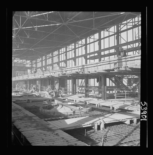 Untitled photo, possibly related to: Las Vegas, Nevada. A construction scene inside one of the huge buildings of the Basic Magnesium Incorporated plant in the southern Nevada desert. Workmen are busy with the steel structure and carpenter work