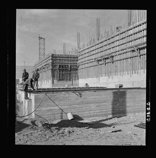 Untitled photo, possibly related to: Las Vegas, Nevada. Helmeted welders busy in their part in the completion of the Basic Magnesium plant in the southern Nevada desert, which will turn out great quantities of this lightest of all metals for aircraft and tracer bullet manufacturers