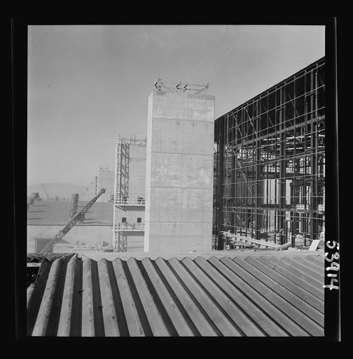 Untitled photo, possibly related to: Las Vegas, Nevada. Some completed and also some unfinished buildings of the Basic Magnesium Incorporated plant. The building at the far right of the picture is still in the steel structure stage