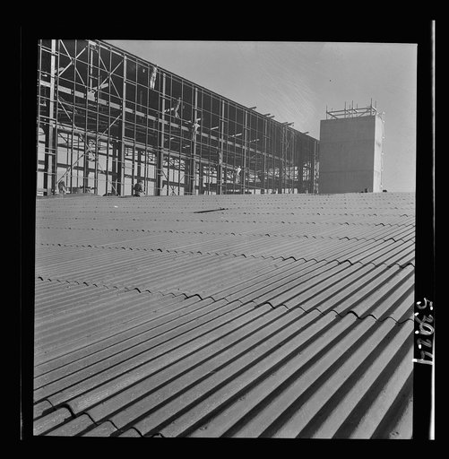Untitled photo, possibly related to: Las Vegas, Nevada. Some completed and also some unfinished buildings of the Basic Magnesium Incorporated plant. The building at the far right of the picture is still in the steel structure stage